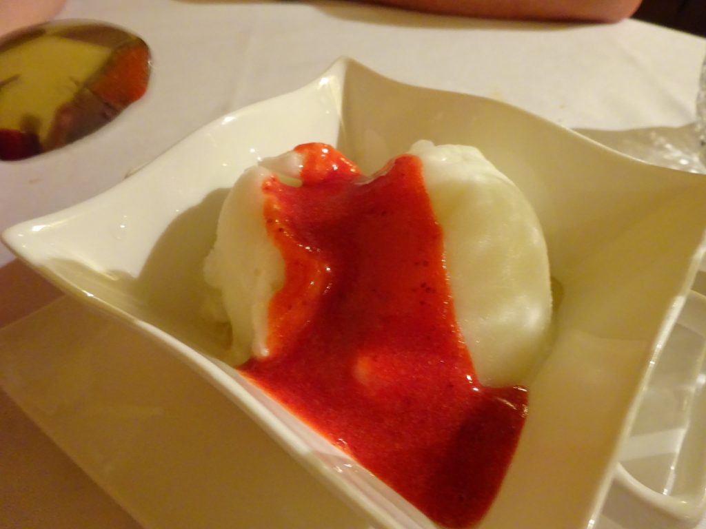 Limone gelato with strawberry sauce